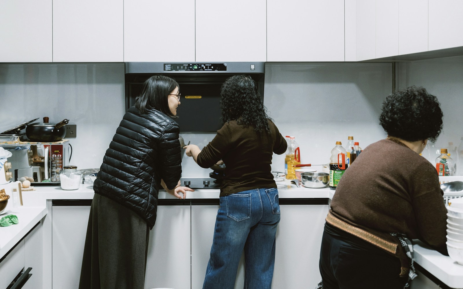 Family preparing food together in a kitchen